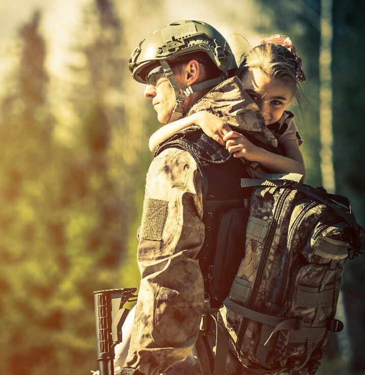 Special Ops Soldier returning home with daughter in his arms