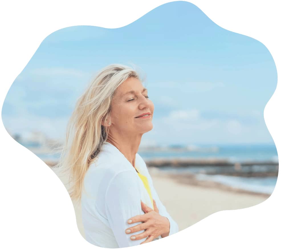 Middle aged woman breathing in fresh air